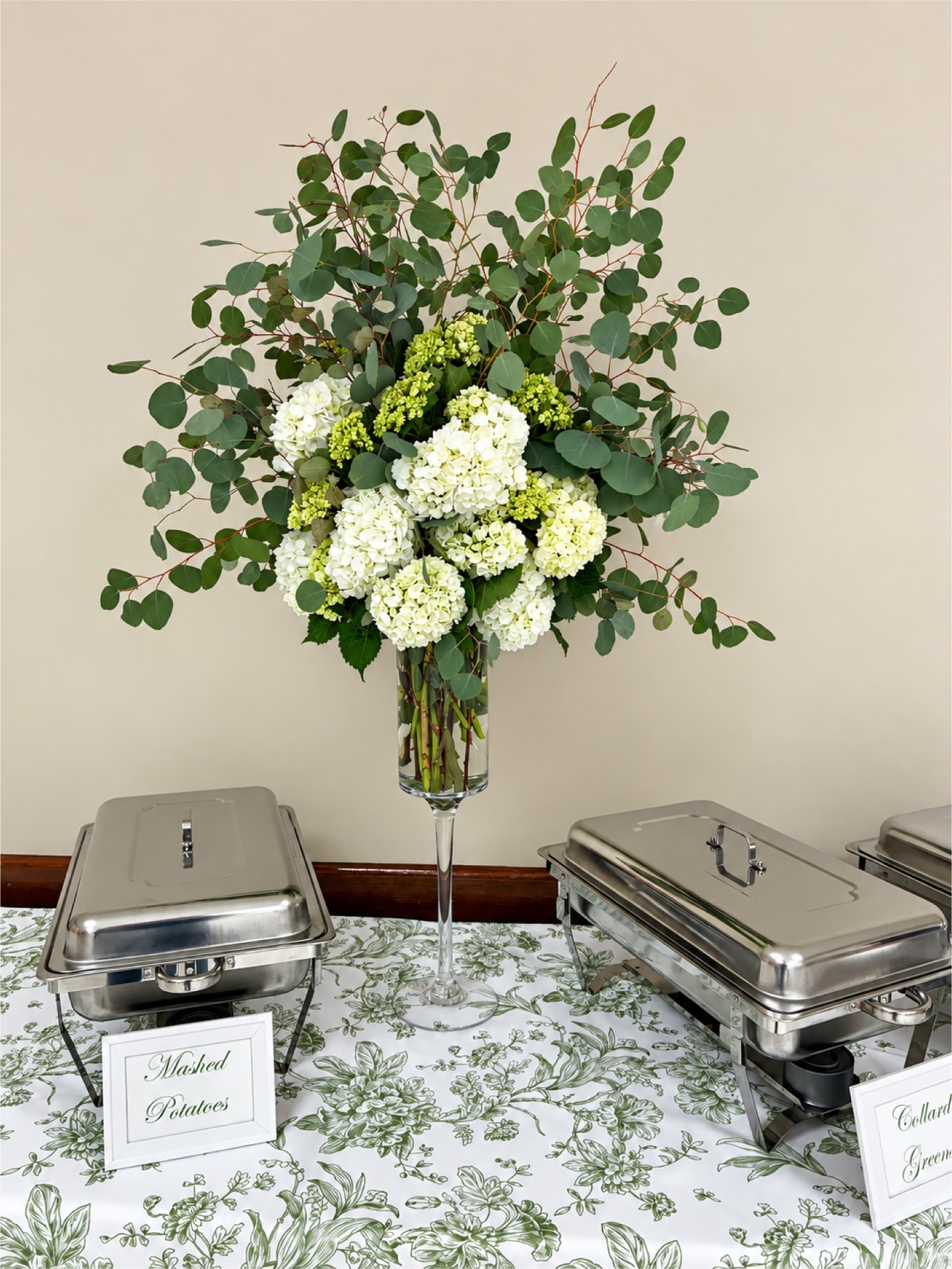 Elegant catering display with floral centerpiece at The Sinclair Room